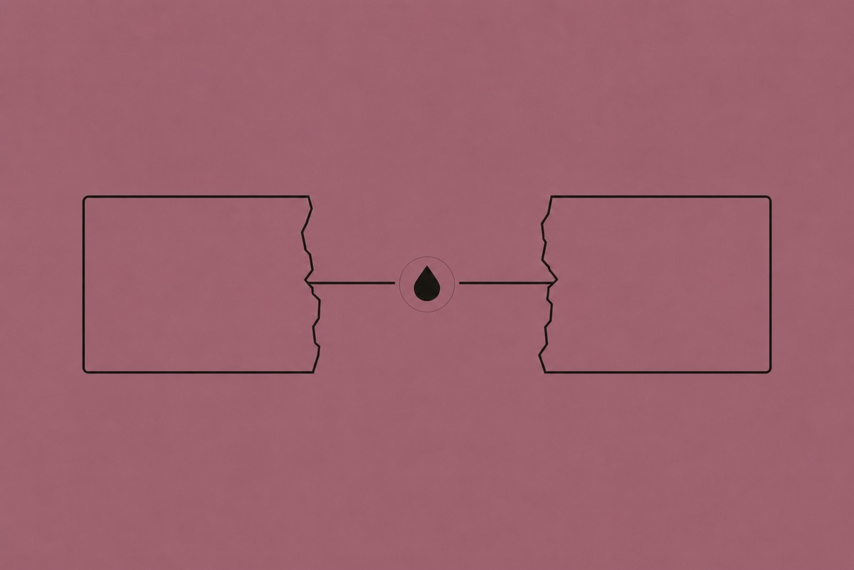 Two broken halves bridged by a glue droplet